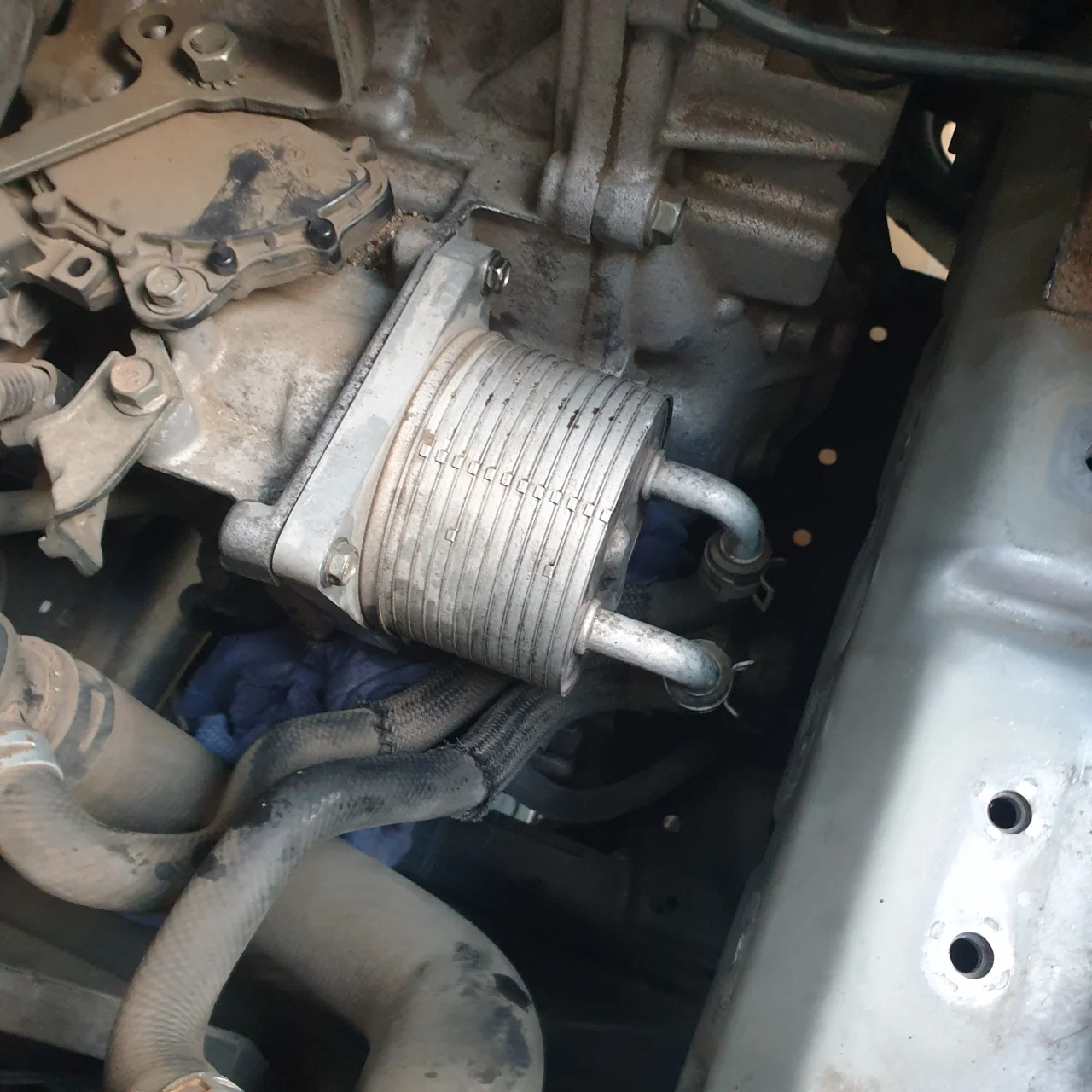 Transmission cooler filter housing