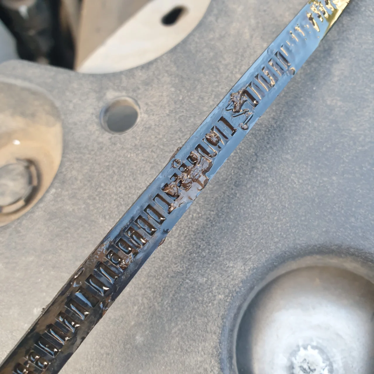 Dirty washer fluid dipstick